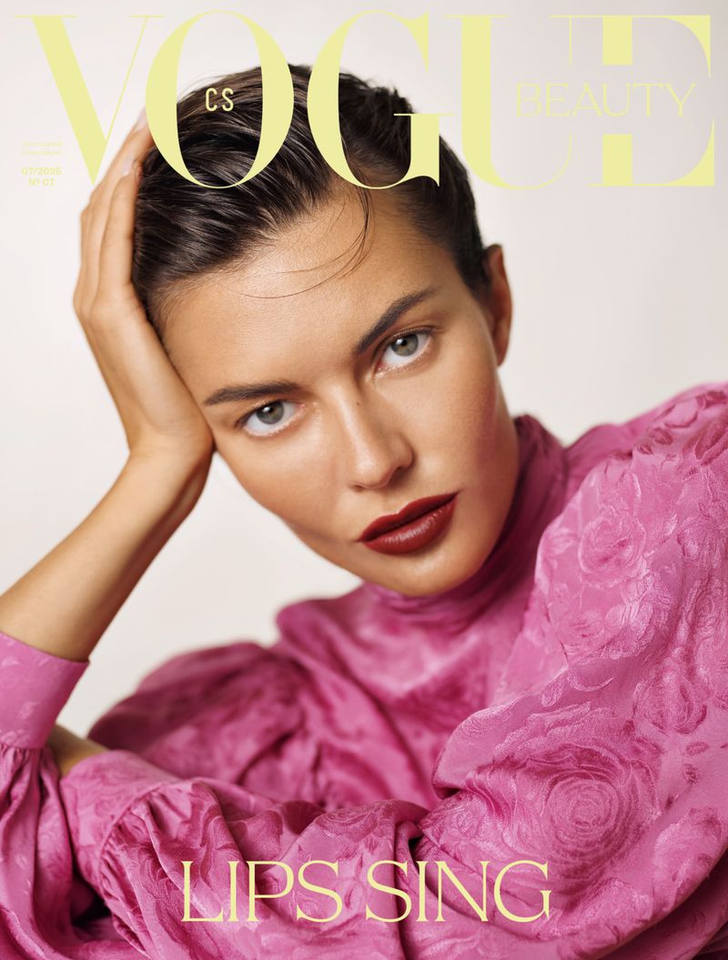 Vogue beauty magazine cover featuring a portrait of a woman with dark red lipstick, wearing a pink floral patterned top.