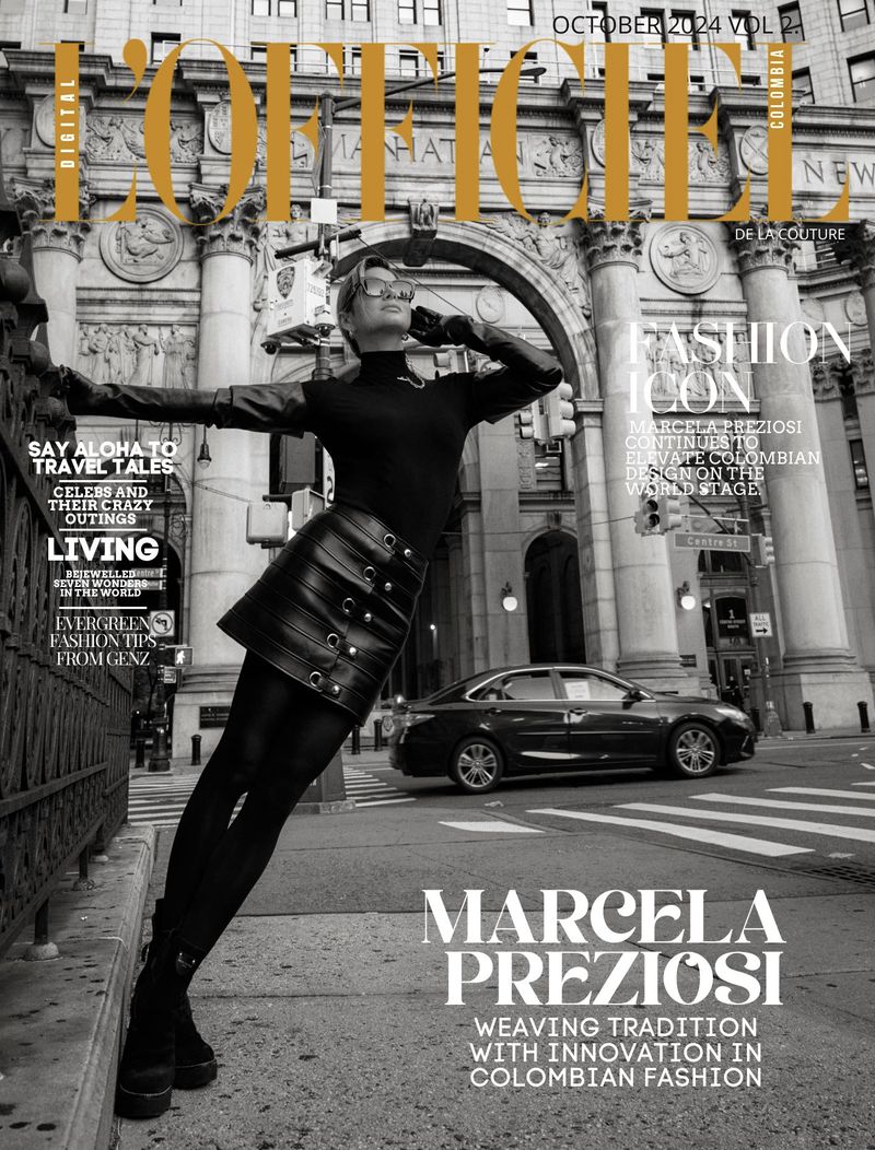 Magazine cover features a woman in black leather skirt and top striking a pose in a city street with a car in the background.