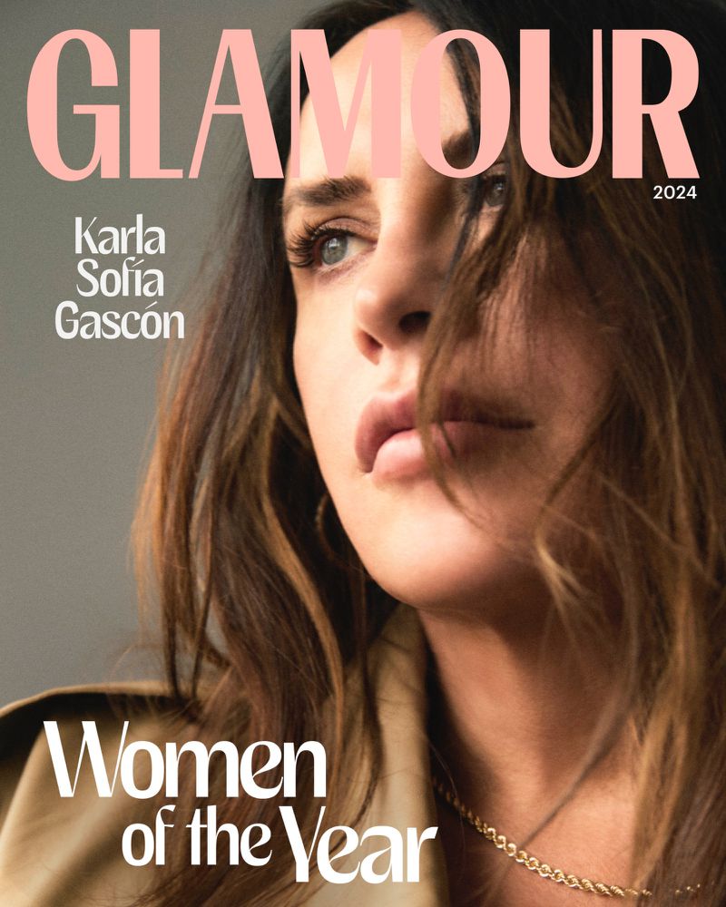 Glamour magazine cover featuring Karla Sofia Gascón in 2024, close-up portrait with natural makeup, light brown hair, and a gold necklace.