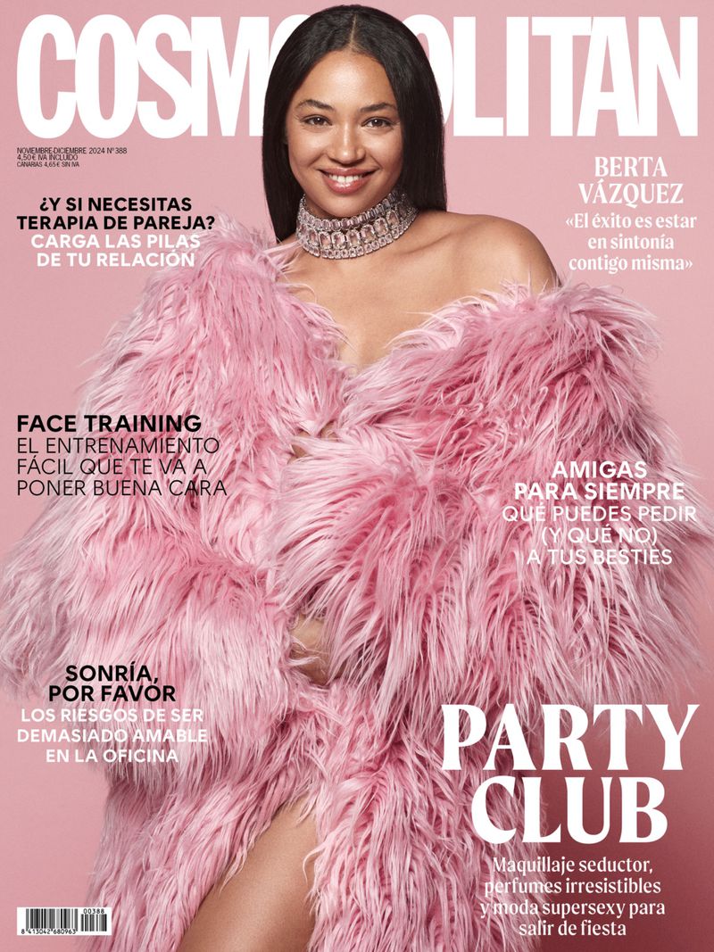 Cosmopolitan cover featuring adult female in pink fur coat, smiling, and wearing a necklace. Magazine cover has text and pink background.