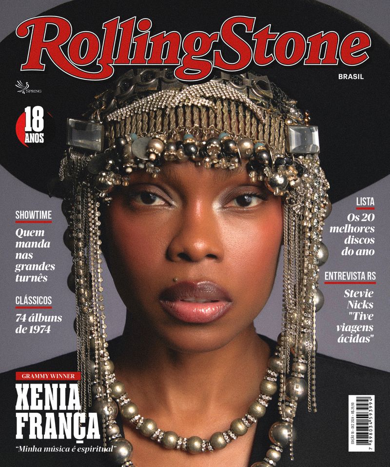 Rolling Stone Brasil cover featuring Xenia França in a close-up shot, wearing an ornate headpiece and necklace, against a dark background.
