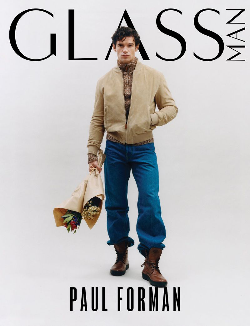 Front cover of Glass Man magazine featuring Paul Forman in casual style, holding flowers, set against a clean white background.