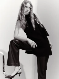 Model Sabine Glud in a black sleeveless top, leather pants, and pointed slingback kitten heels for Massimo Dutti.