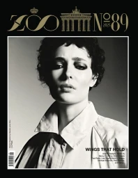 Monochrome portrait of model Celeste Fitzpatrick wearing a collared coat on the cover of Zoo Magazine Issue 89.