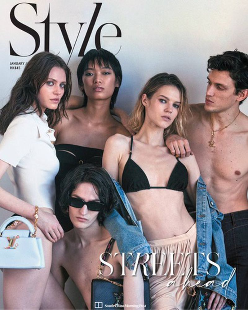 Magazine cover with five fashion models, featuring diverse poses and apparel, with white backdrop and bold “Style” masthead.