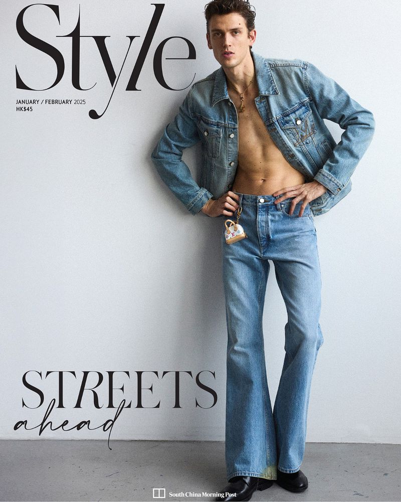 Magazine cover featuring a slender man in a denim jacket and jeans, posing against a white wall with the word 'Style' printed above him.