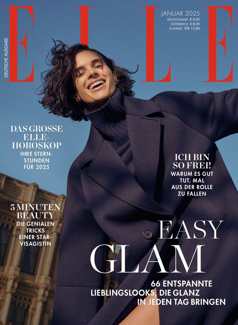 Elle magazine cover featuring a smiling woman in a blue coat against a sky background and architecture, with 'Easy Glam' headline.