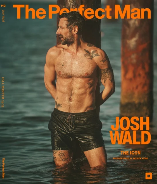 Magazine cover featuring a shirtless adult male with tattoos, standing in shallow water near wooden posts, fashion, beauty, celebrity content.