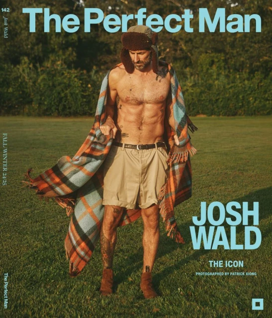 Man wearing a hat and blanket stands in a field for a magazine cover; the text says, 'The Perfect Man, Josh Wald, The Icon'.