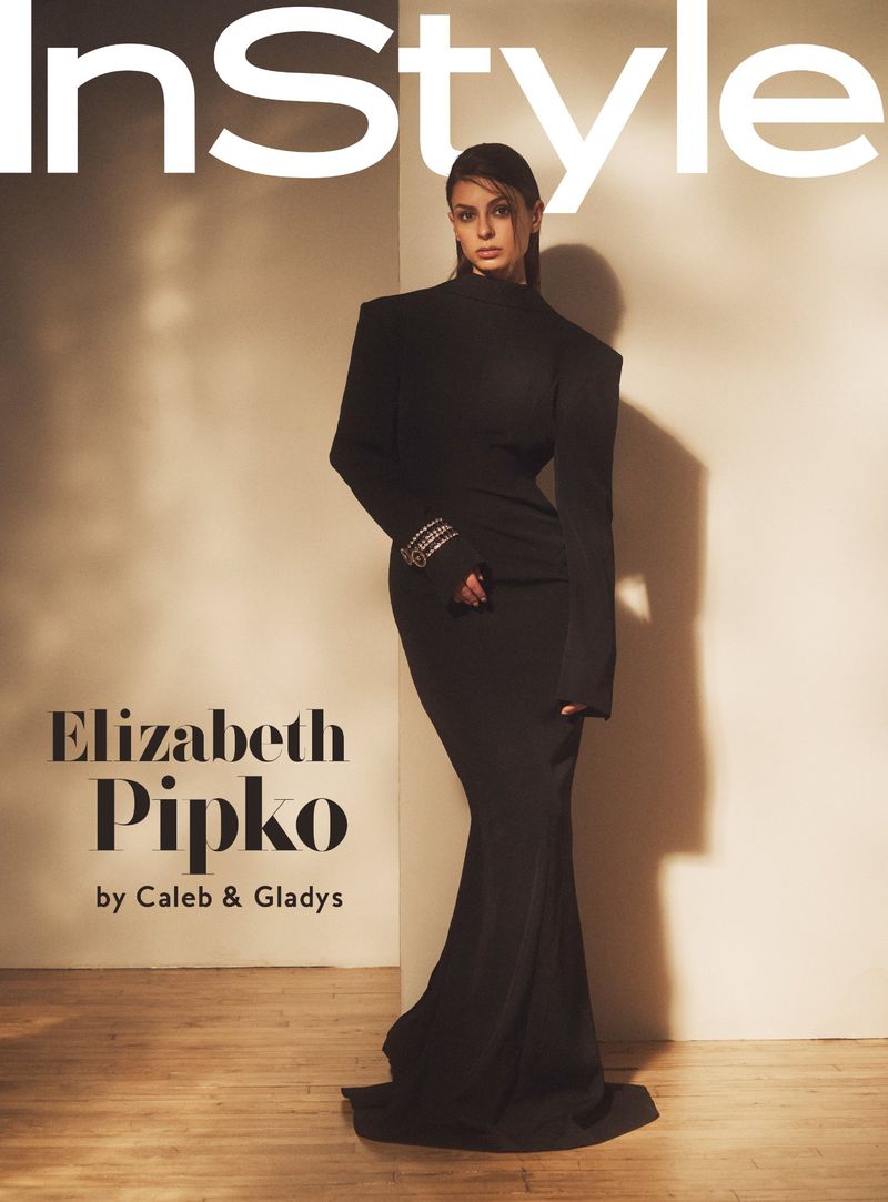 Fashion editorial cover of Elizabeth Pipko wearing a black form-fitting dress with an InStyle magazine logo in the background.