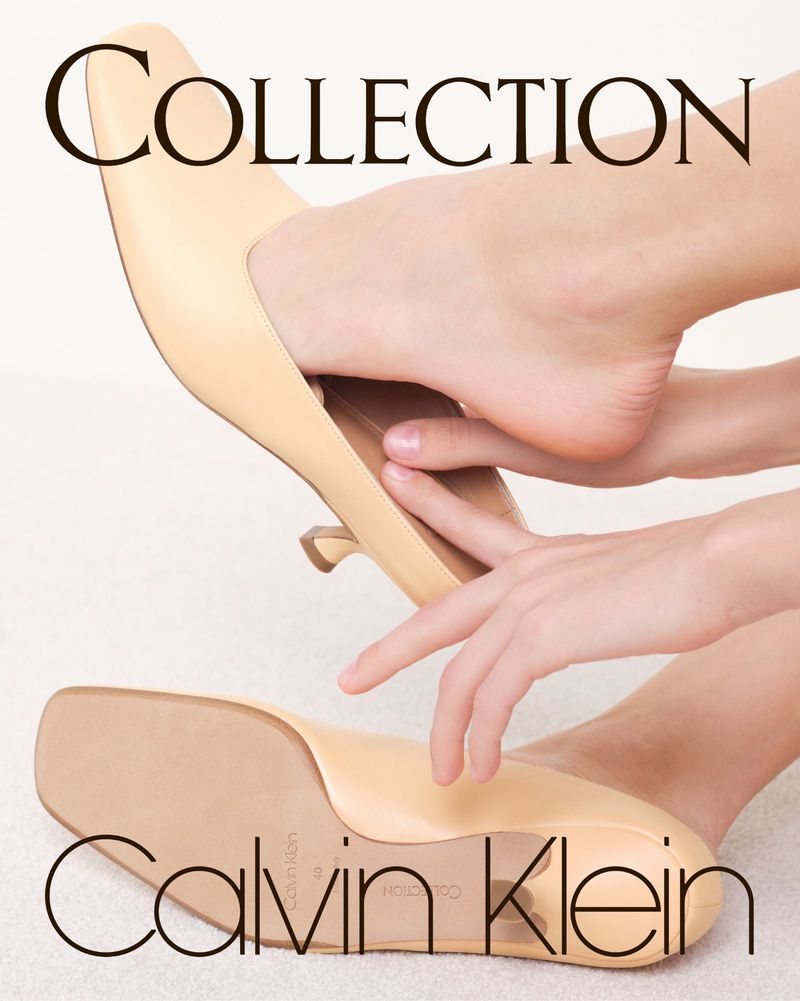 Foot wearing a beige Calvin Klein stiletto heel with 'Collection' text, focusing on fashion, style, and the elegance of footwear.