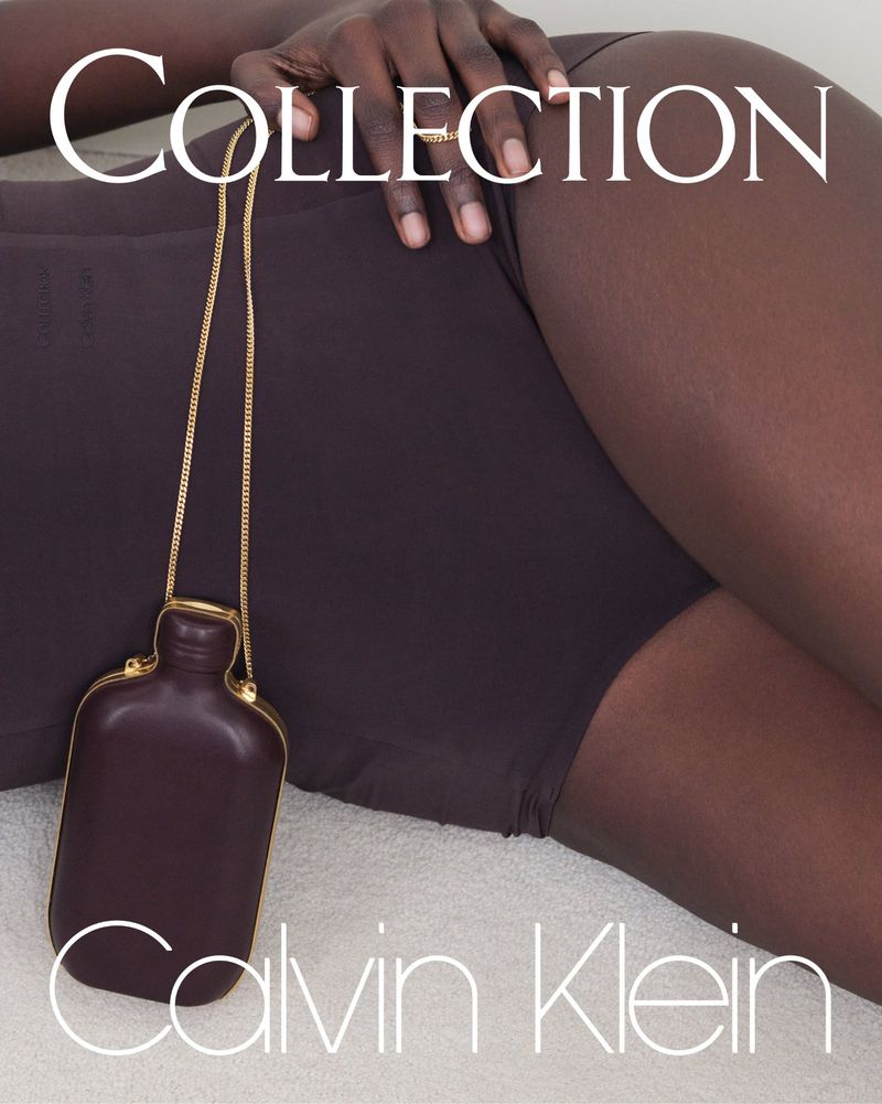 Dark-skinned woman laying down with a small brown purse on a light background in a studio setting for a fashion advertisement.