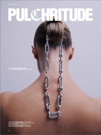 Magazine cover featuring a woman's back with a chain and styled hair against a grey backdrop. Pulchritude magazine title visible.