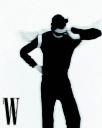 Model Hoyong Kim posing with motion-blurred gestures in an all-black outfit against a pure white background for W Korea.