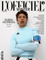 Ruben Moreira wearing a light blue ski top and ski goggles on his arm on the L'Officiel Riviera Winter magazine cover.