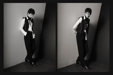 Black and white diptych of model Jack Stewart posing in a black vest, white shirt, oversized necktie, and trousers in a studio corner.