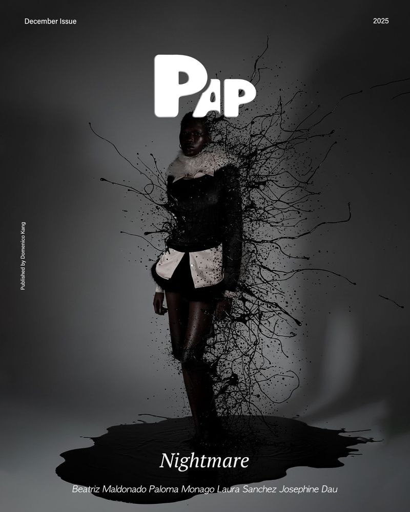 A dark-skinned model stands on a black ink puddle against a gray backdrop in a fashion-editorial magazine cover with 'Nightmare' as the title.
