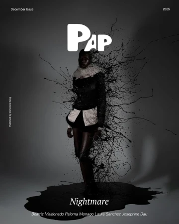 A dark-skinned model stands on a black ink puddle against a gray backdrop in a fashion-editorial magazine cover with 'Nightmare' as the title.