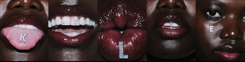Macro view of five African American faces with letters on their mouths and face, against a black backdrop, beauty and fashion concept.