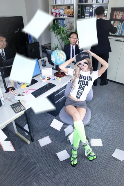Young woman sits in an office chair surrounded by flying papers, colleagues working in the background, and a desk with office supplies.