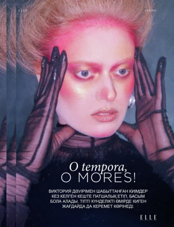 Editorial fashion shot: A woman with pink and gold makeup wears sheer gloves in a studio setting, featured in ELLE magazine.