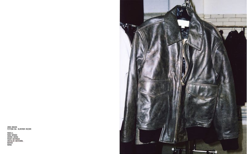 Distressed dark leather jacket hanging on a rack during a Zara Origins fitting session