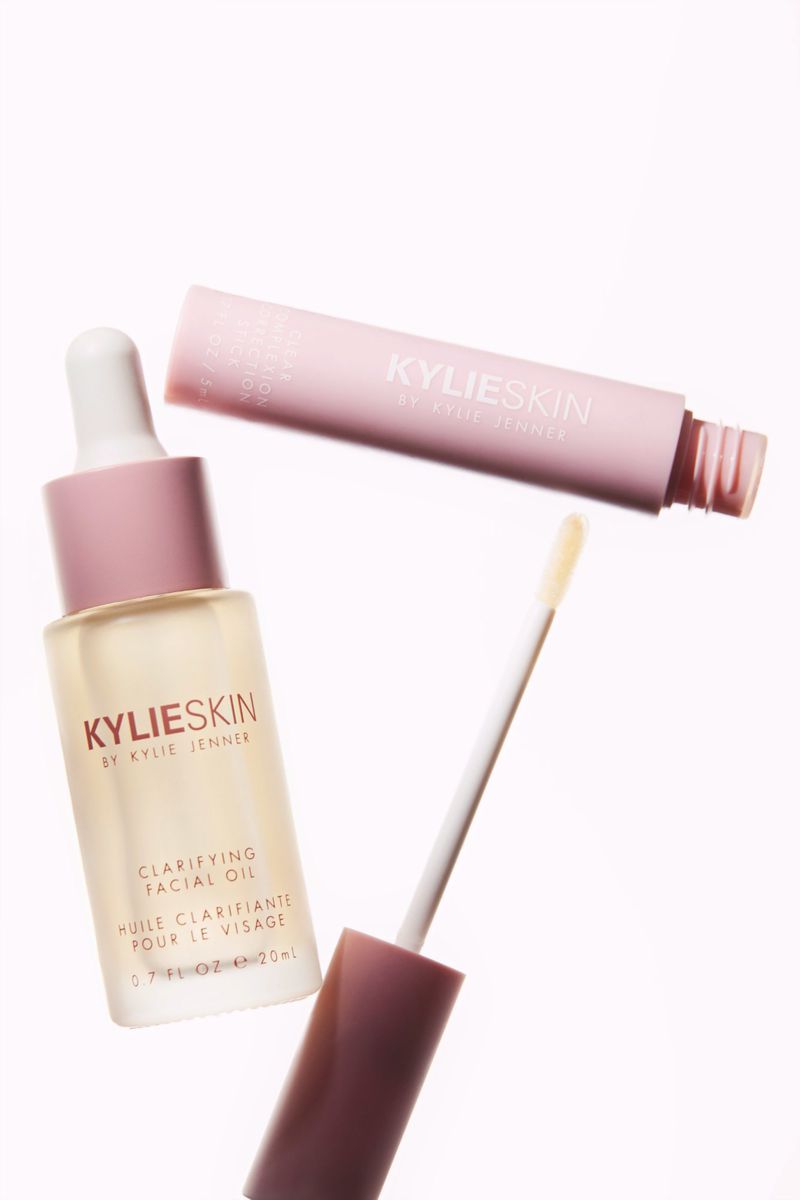 Kylie Skin clarifying facial oil and lip serum with applicator on white backdrop. Beauty and skincare product photography.