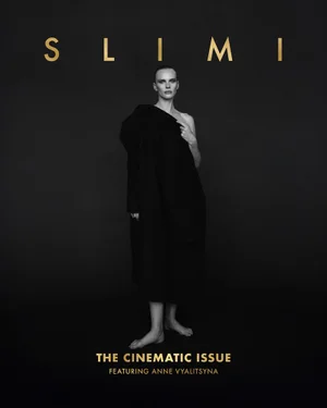 Model Anne Vyalitsyna draped in dark fabric against a black background for Slimi Magazine