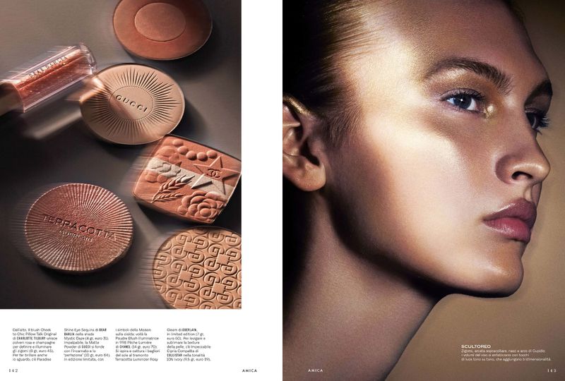 Beauty product editorial featuring a woman's face with gold makeup and several cosmetic compacts in shades of bronze and gold.