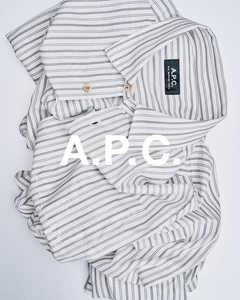 Striped collared shirt by A.P.C. is captured in a flat lay with a bright background, featuring the brand's logo prominently.