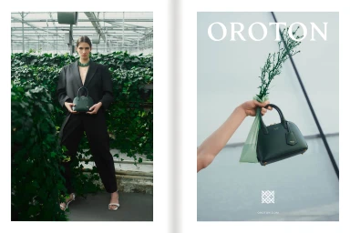 Model in black suit holding a dark green handbag inside a greenhouse for Oroton Spring project by Georges Antoni