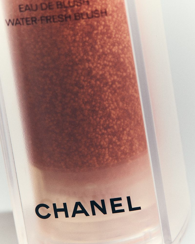 Close-up studio shot of Chanel Eau de Blush Water-Fresh Blush bottle, product shot, elegant packaging, and beauty product photography.