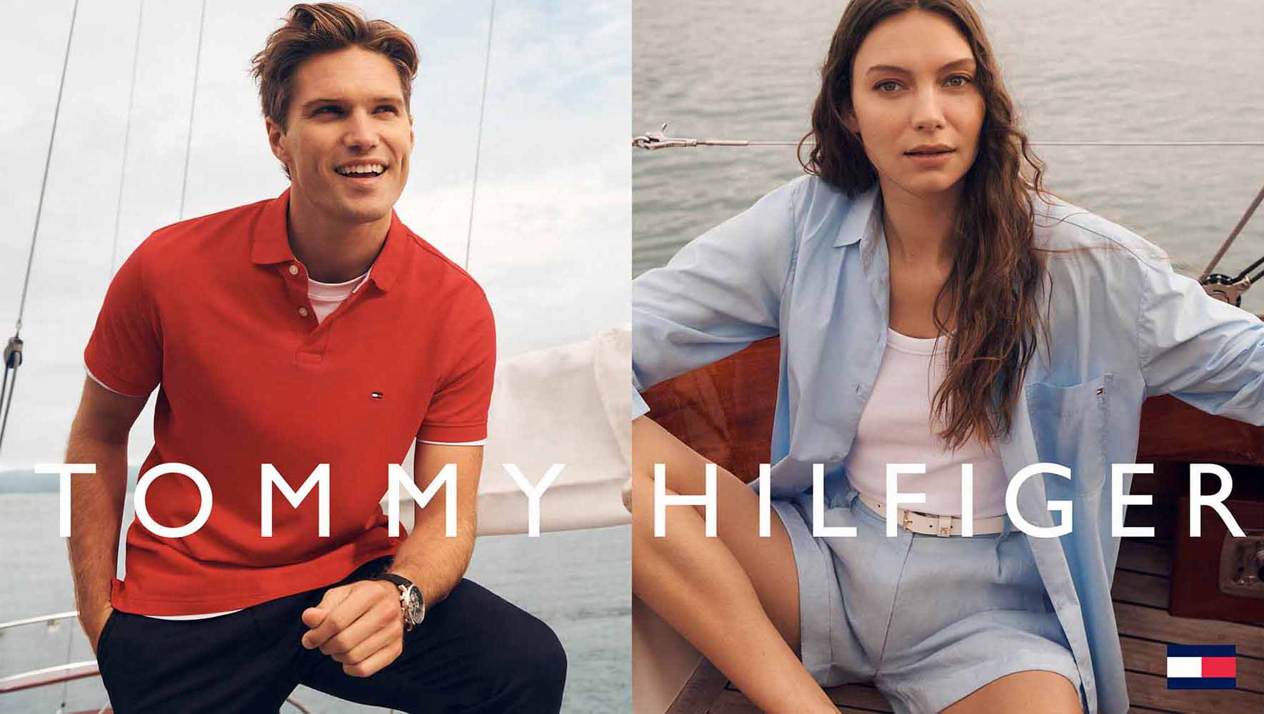 Two fashion models pose on a sailboat deck in an outdoor fashion ad. The models wear clothes by Tommy Hilfiger.