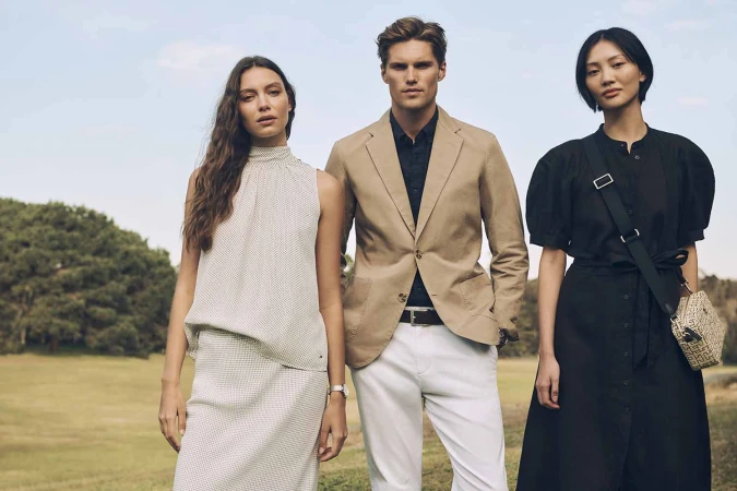 Three fashion models posing outdoors against a park background for Justin Woo project Australia Summer24
