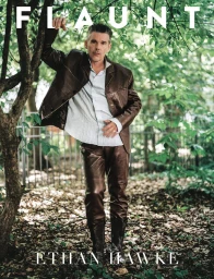 Ethan Hawke leaning against a tree trunk in a brown leather jacket and trousers set for Flaunt magazine portrait.