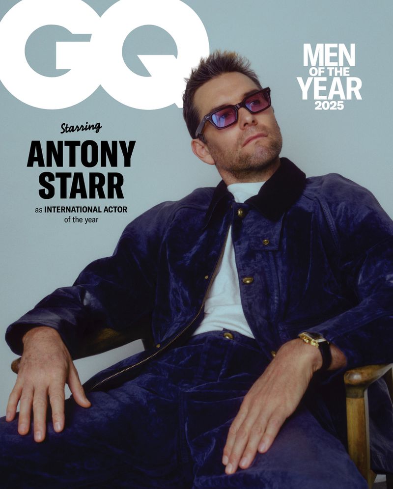 GQ magazine cover featuring Antony Starr, named International Actor of the Year 2025, posing in a blue velvet suit and tinted sunglasses.