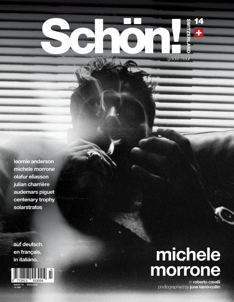 Magazine cover featuring Michele Morrone in black and white, promoting an article in Roberto Cavalli, against a blurred background.