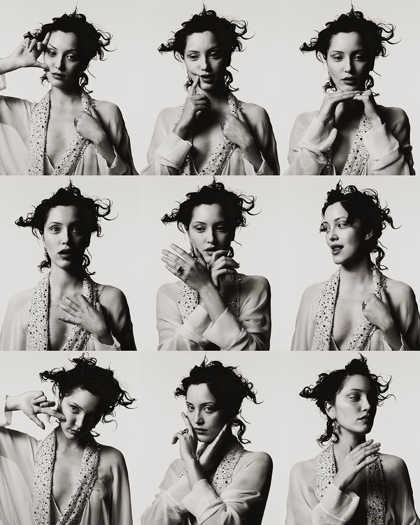 Multiple portraits of a woman with dark hair and pale skin wearing a robe, posing with her hands in front of a light background.