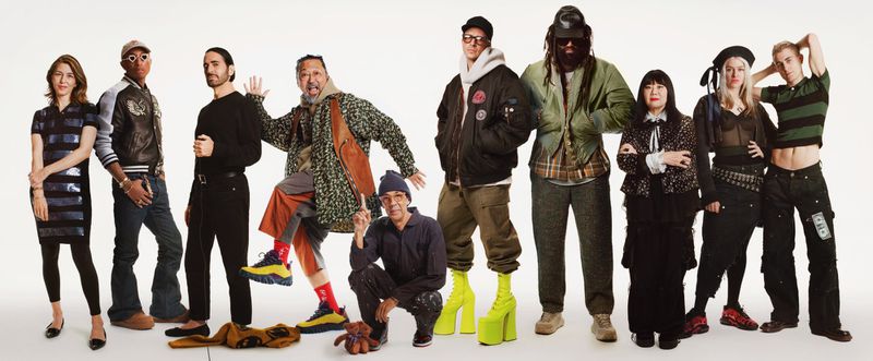 Diverse group of eleven people in colorful fashion, standing against a bright white backdrop, showcasing individual style and poses.
