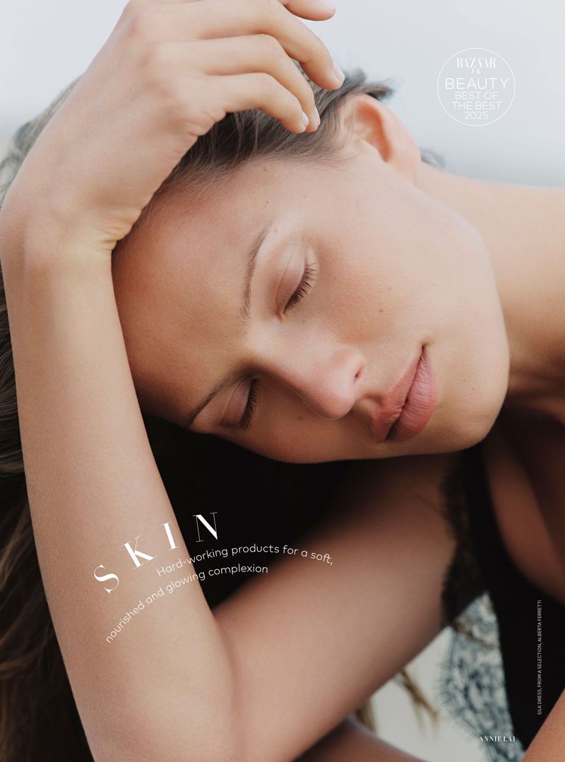 Close-up beauty portrait of model Lea Seelenmeyer with eyes closed and hand resting on her forehead for Harper's Bazaar UK.