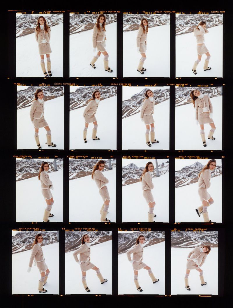 Fashion shot of a woman in a beige skirt and sweater with knee-high boots posing on a snow-covered mountain, captured in a contact sheet.
