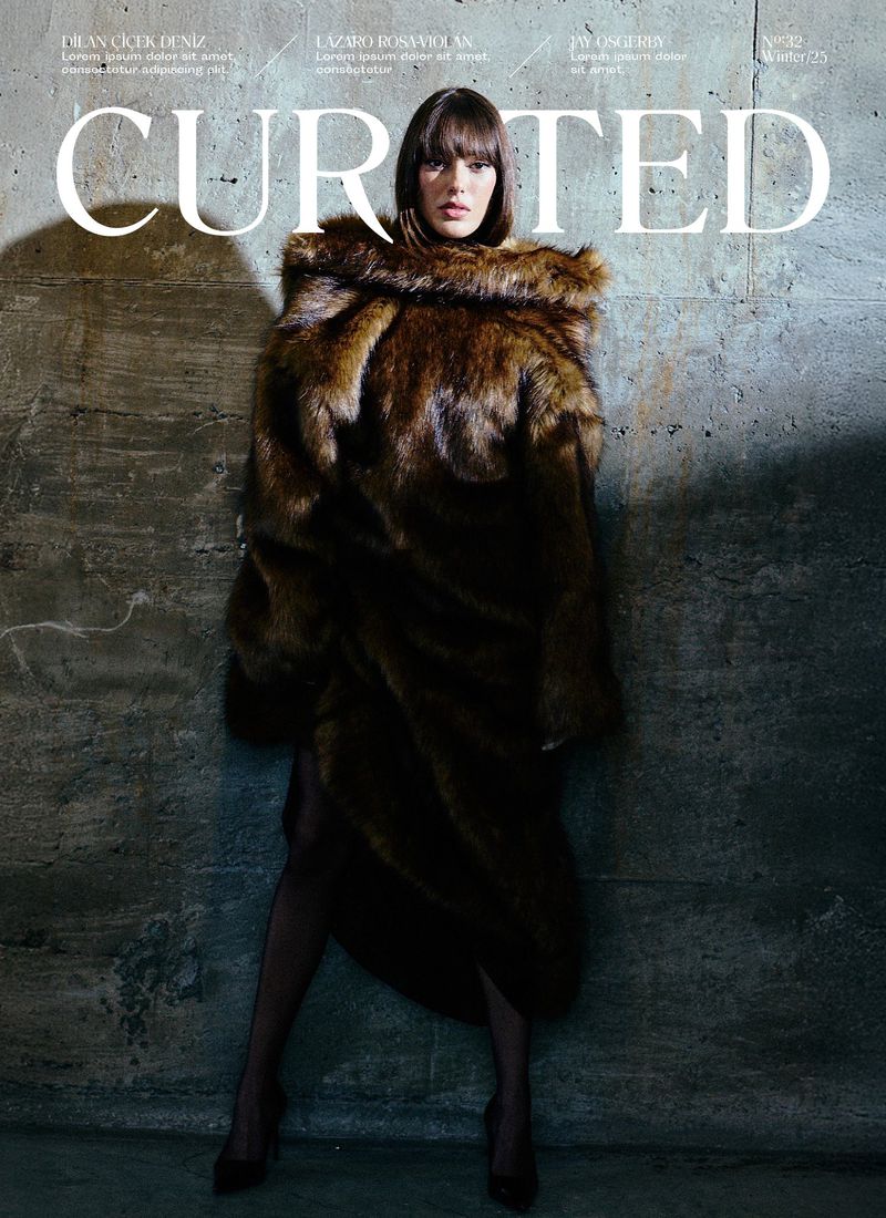 Fashion magazine cover featuring a woman in a fur coat, standing against a textured wall with the magazine title 'CURATED' displayed prominently.