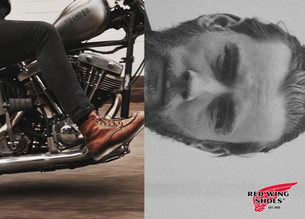 Motorcycle rider wearing brown leather boots; half of a man's face is visible next to the Red Wing Shoes logo.