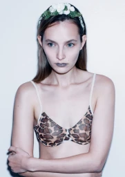 Model Ruby Hill in a leopard print bra and floral headband for L'Officiel Philippines Second Skin editorial.