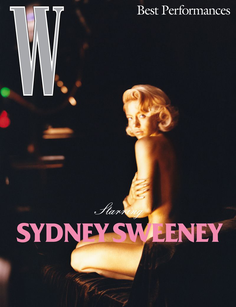 Sydney Sweeney is featured on a 'W' magazine cover with a soft, dark background and pink text at the bottom.