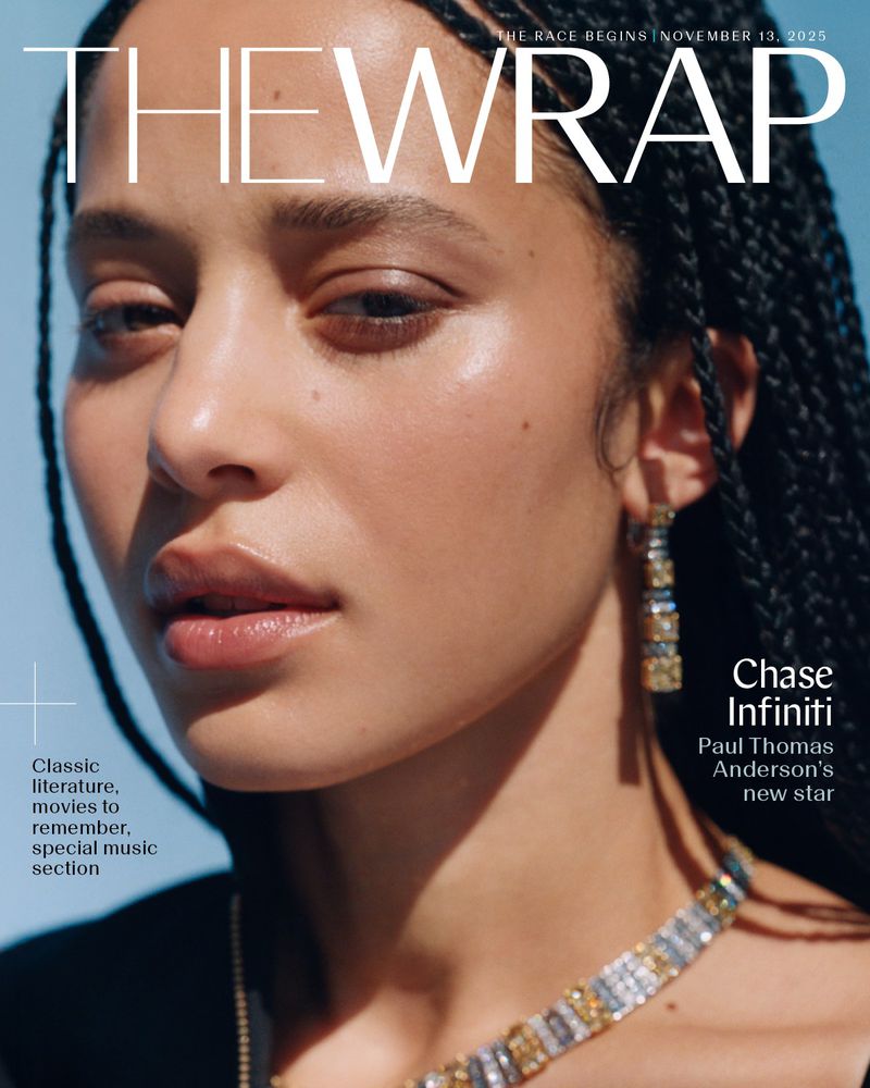 Close-up magazine cover of a woman with dark braided hair and jewelry against a light blue background with magazine text overlay.
