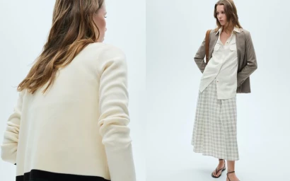 Model in brown blazer, white shirt, and plaid skirt posing against a clean white seamless studio background.