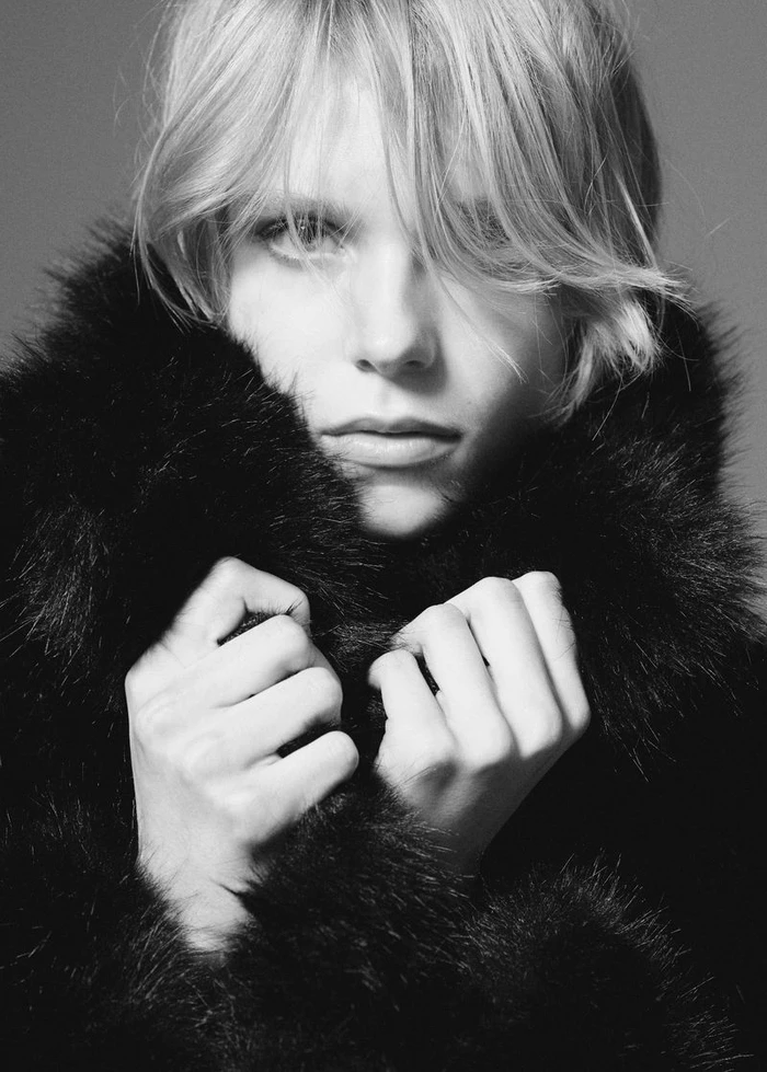 Close-up portrait of model Tora Grieg-Cappelen wearing a fluffy black faux fur coat for Mango.
