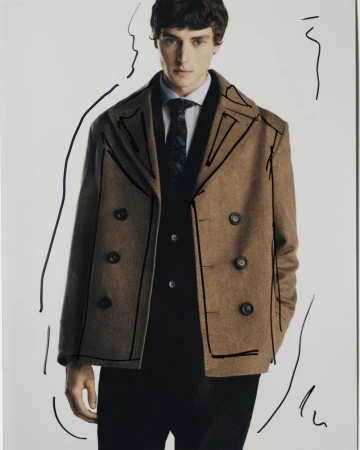 Man wearing a brown double-breasted coat, blue shirt, patterned tie, and black vest against a white seamless background with hand-drawn lines