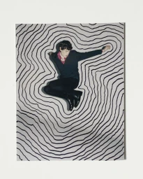 A man in a dark suit jumping against a white background featuring hand-drawn black concentric contour lines.